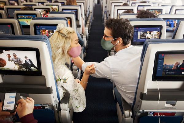 Passengers enjoying in-flight entertainment.