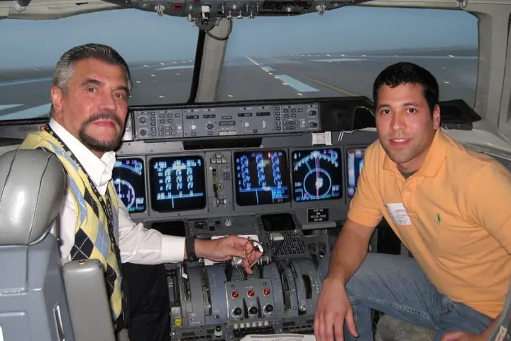 Mike Farinas and his father in the simulator together, pre-pandemic.