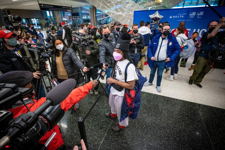 Maame Biney speaks with members of the media as Team USA athletes arrive at Salt Lake City International Airport in Salt Lake City, Utah on Monday, February 21, 2022.