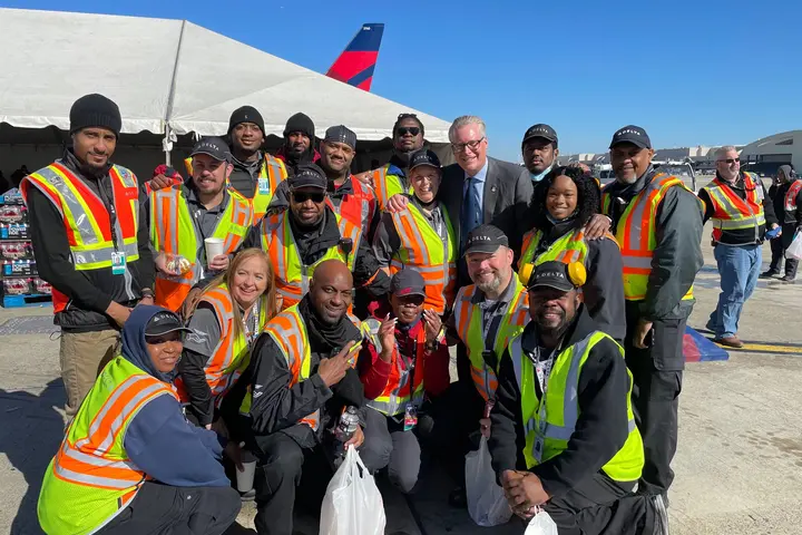 Delta CEO Ed Bastian poses with ramp crew members in Atlanta for Employee Appreciation Day.