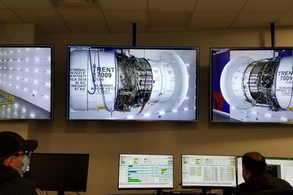 Monitors of a Rolls-Royce Trent 7009 engine test with TechOps employees