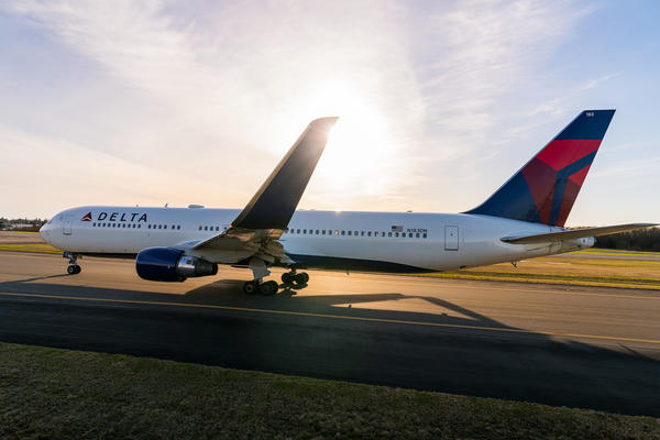 During the heat of the day, Delta's Boeing 767-300 gears for takeoff with a cruising speed of 517 mph.