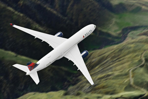 A350-900 in flight over mountains
