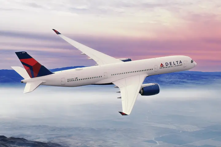 A350-900 in flight with a sunset