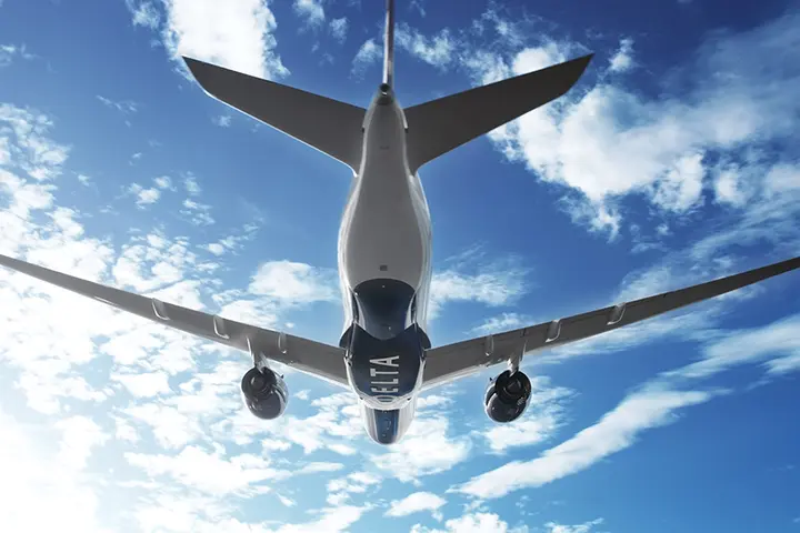 A350-900 in flight against clouds
