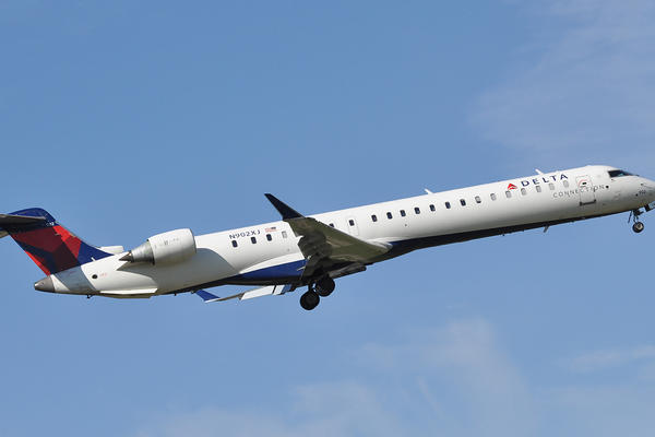 The Bombardier CRJ-900, operated by Delta Connection Carrier Endeavor Air or SkyWest Airlines, takes off.