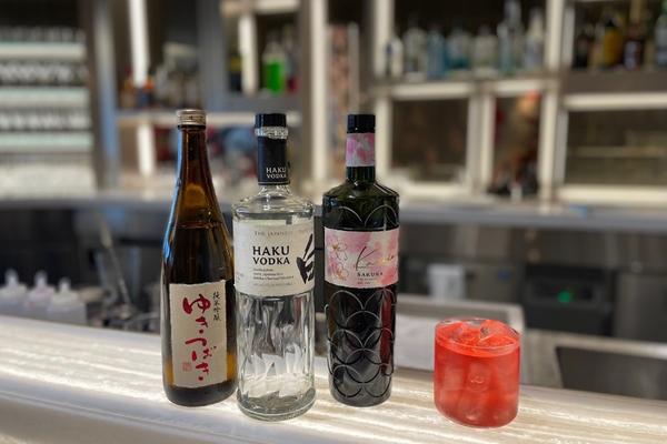 A Sake Blossom Cosmo (right), a cocktail created exclusively for Haneda’s Delta Sky Club.