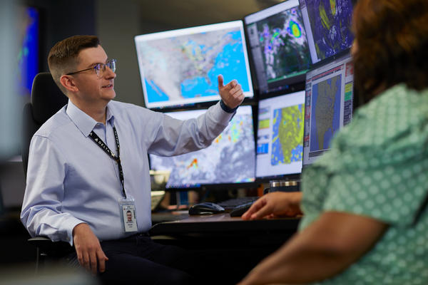 A Delta meteorologist monitors weather conditions at the Operations and Customer Center. (File photo)