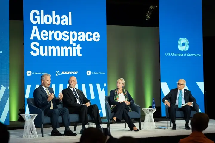 Capt. Patrick Burns (left) speaks on a panel at the U.S. Chamber of Commerce Global Aerospace Summit in September 2022.