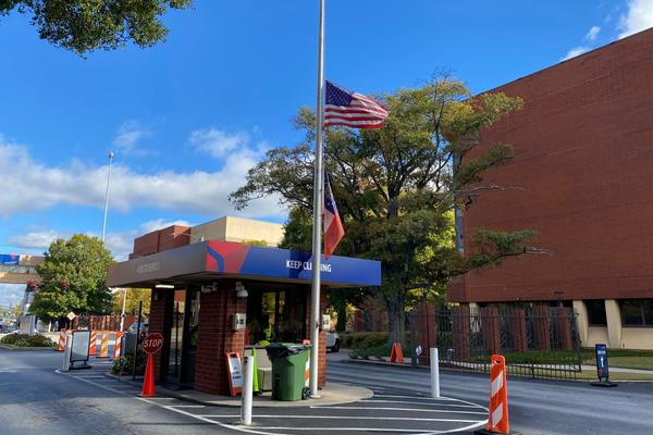 Flags are shown at half-staff at Delta's Atlanta headquarters on Wednesday, Oct. 26, 2022.