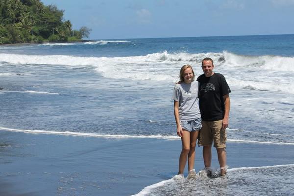 A320 Delta Captain Michael Wilkinson and his daughter stand on a beach in Tahiti.