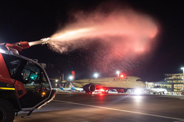 A Delta Air Lines Airbus A350 is welcomed with a water cannon salute upon arrival at Cape Town International Airport (CPT).