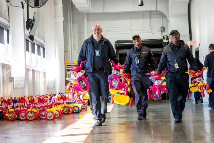 Delta people from TechOps, In-Flight Service, Global Sales, Finance, IT and Flight Operations rallied to purchase and assemble bicycles, as well as rally toy and money donations to support Toys for Tots.