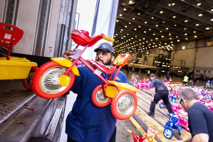 Delta people from TechOps, In-Flight Service, Global Sales, Finance, IT and Flight Operations rallied to purchase and assemble bicycles, as well as rally toy and money donations to support Toys for Tots.