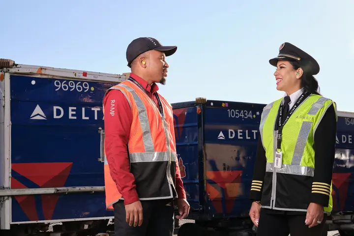 A Delta ramp agent and pilot talk at Hartsfield-Jackson Atlanta International Aiport.