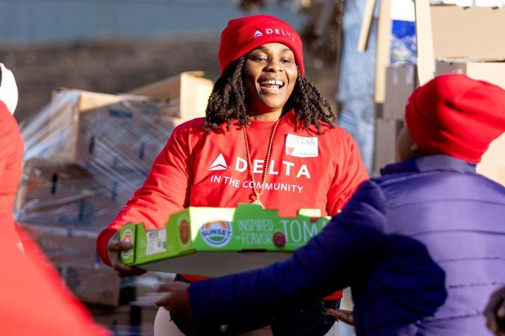A Delta employee volunteers at Hosea Helps in Atlanta during the annual "Hosea Helps Festival of Services" event.