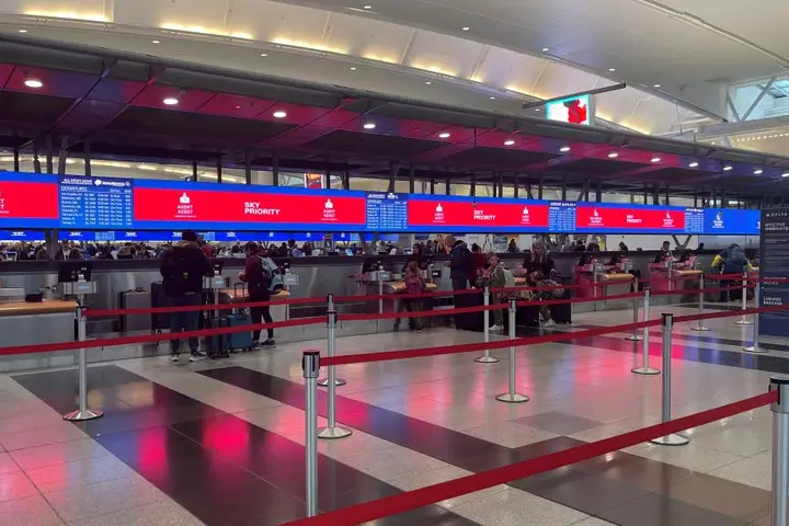 Delta’s signature digital backwall with up-to-date gate information at New York - JFK.