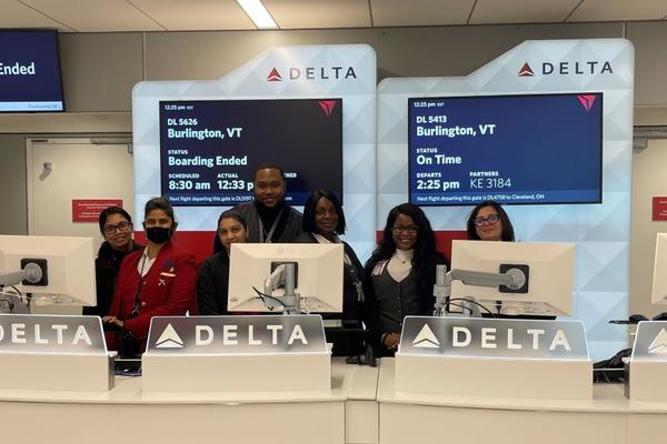 Delta employees stand at a gate in Delta's newly consolidated Terminal 4 at New York City - JFK.