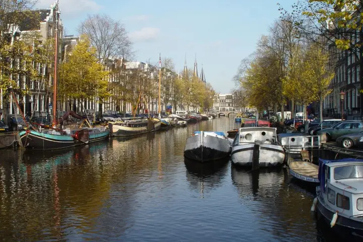 Boats and houses line one of Amsterdam's many canals.