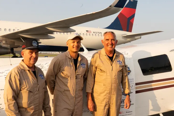 Pilots Barry Behnfeldt and Aaron Wilson, along with maintenance technician Thomas Twiddy make a stop at Hartsfield-Jackson Atlanta International Airport (ATL) during their 48N48 mission -- an attempt to land in all 48 of the contiguous states within 48 hours. They were greeted by Delta Chief of Operations John Laughter.