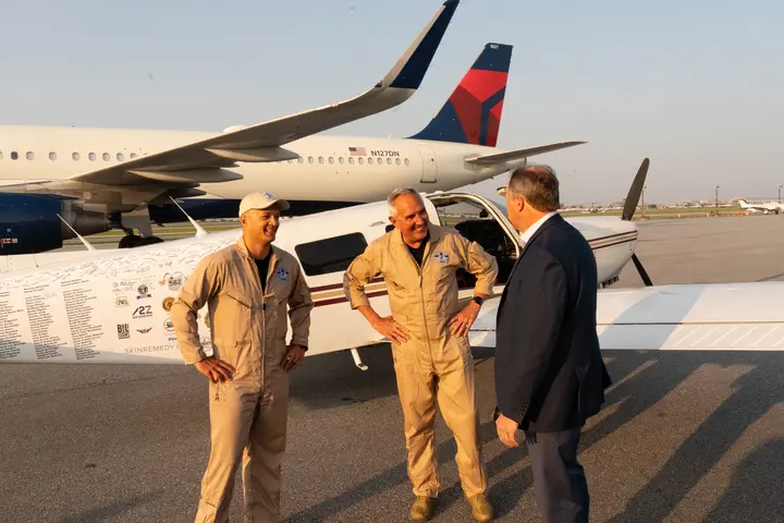 Pilots Barry Behnfeldt and Aaron Wilson, along with maintenance technician Thomas Twiddy make a stop at Hartsfield-Jackson Atlanta International Airport (ATL) during their 48N48 mission -- an attempt to land in all 48 of the contiguous states within 48 hours. They were greeted by Delta Chief of Operations John Laughter.