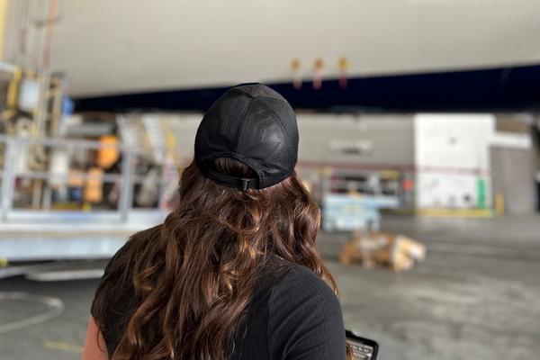 Emma Galarza, a senior engineer with TechOps, overseeing an autonomous drone inspection of a Delta Airbus A350-900.