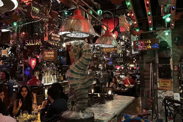 The inside of Andres Carne de Res in Bogota, Colombia, a steakhouse that serves Colombian classics and is a lively club at night