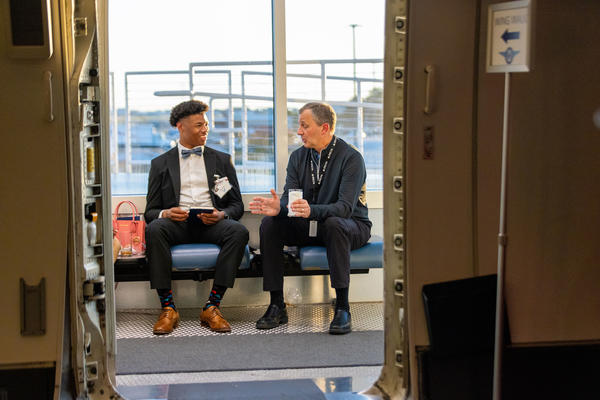 An attendee of Delta's "From the Yard to Delta Boulevard experience sits down to talk with a Delta employee about the airline's culture.