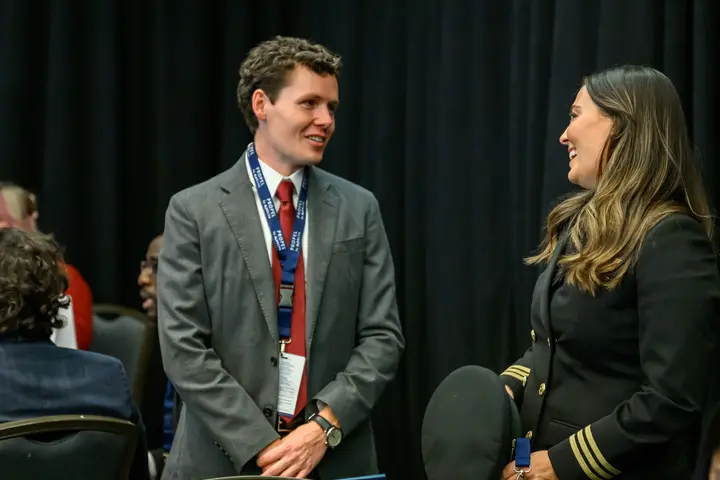Delta employee Michael Hulse speaks with Samantha Warren, a Delta pilot and the very first Propel Company graduate.