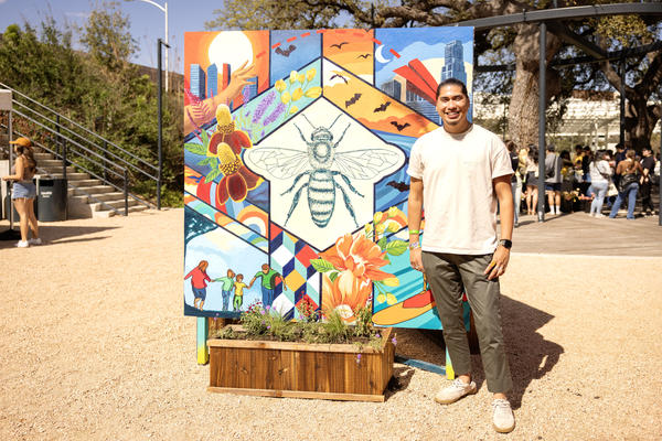Ruben Esquivel of East End Eclectic stands next to a mural he co-designed with Kat Talley and Delta Air Lines. The mural will be utilized as part of Waterloo Greenway's annual Artist in Residence program with East End Eclectic through the summer and highlighted during spring and summer as part of Waterloo Greenway’s environmental and art programs. 