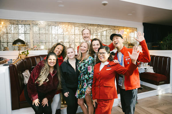 Delta flight attendants and Red Coats, who provided the airline's signature welcoming, elevated and caring hospitality to Delta Lounge attendees within the pop-up and beyond during SXSW 2024, pose with Chief Marketing Officer Alicia Tillman.