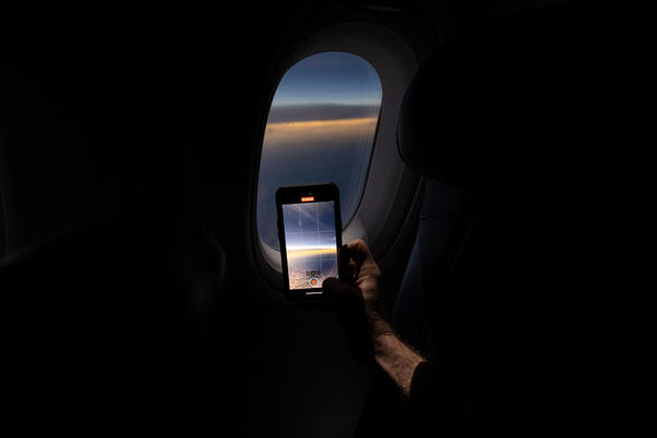 Customers on board DL 1010 from Dallas Fort Worth International Airport (DTW) to Detroit Wayne County Metropolitan Airport (DFW) view the solar eclipse.