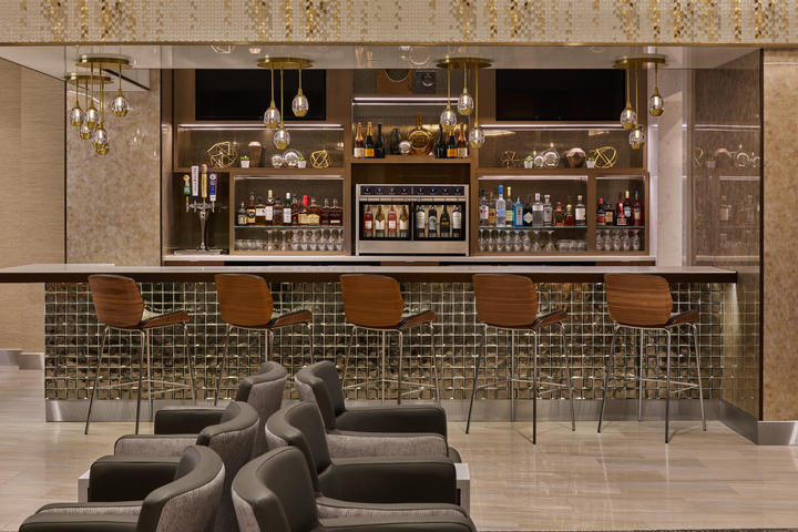 The Delta Sky Club at Detroit Metropolitan Airport features a premium bar that provides guests with access to complimentary beverages as well as upgraded options like premium wines, spirits, beer and signature cocktails. 