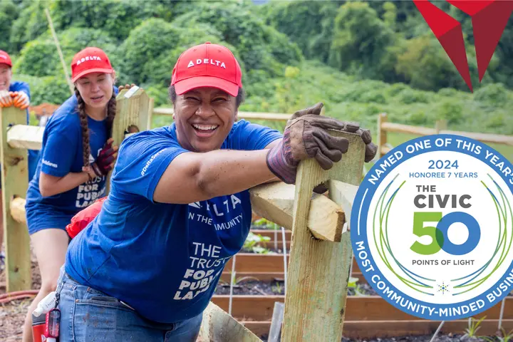 A Points of Light Civic 50 logo against a photo of Delta people volunteering