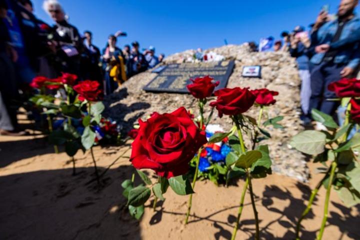 After signing countless autographs, the veterans enjoyed a ride on World War II-era vehicles to Omaha Beach, where they laid roses to remember comrades who lost their lives on those shores.