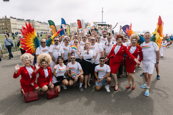 Delta and Virgin Atlantic people pose at the Brighton & Hove Pride parade.