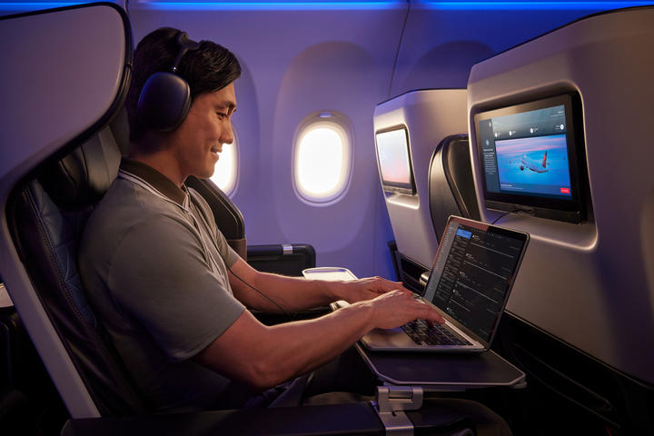 A customer uses their personal device onboard