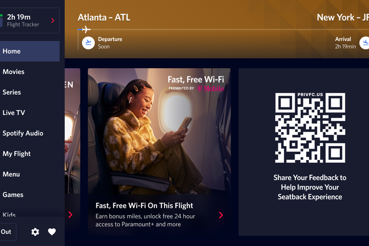 A seatback screen shows a QR code that gives customers the ability to give in-flight customer feedback.