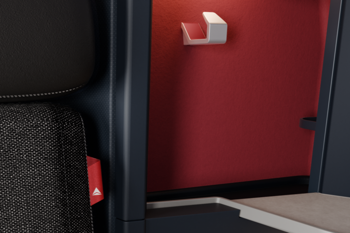 A “thread of red” is being introduced in premium cabins to highlight customer features like an extra pocket on the seat in front of you or the location of a headset. 