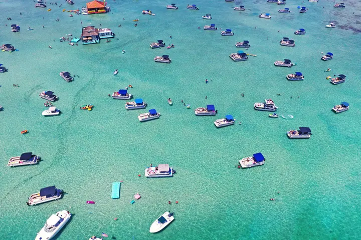 Aerial view of boats on crystal blue waters in Destin, Florida