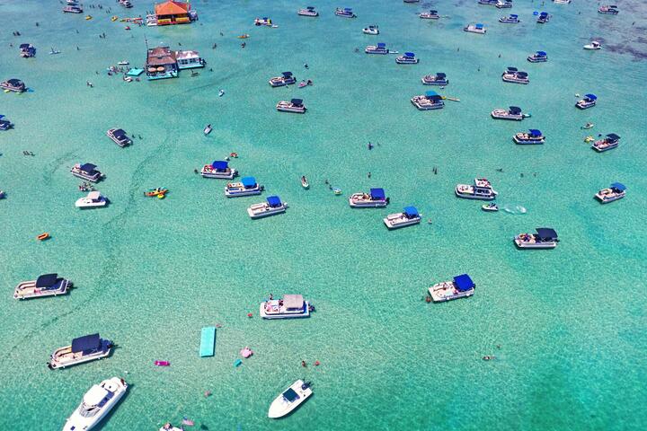 Aerial view of boats on crystal blue waters in Destin, Florida