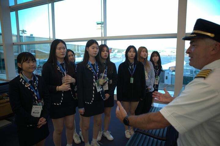 High school students hear from a Delta pilot at ICN Airport during their job shadowing experience with Delta and Junior Achievement.