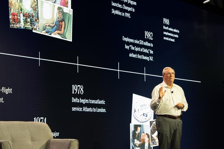 Man giving presentation on stage