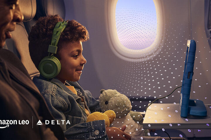  A child seated on an airplane uses a tablet while wearing headphones and holding a stuffed toy, with another seated adult and an airplane window visible, overlaid with a subtle digital pattern.