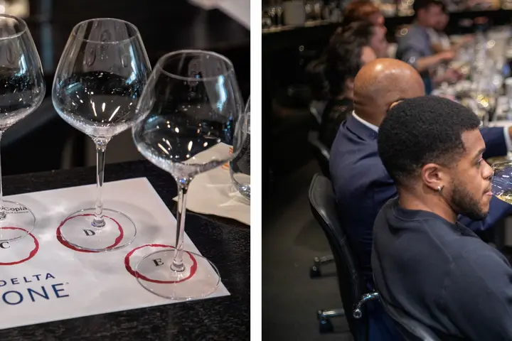 Guests participate in a Delta One wine tasting with multiple wine samples and tasting glasses.