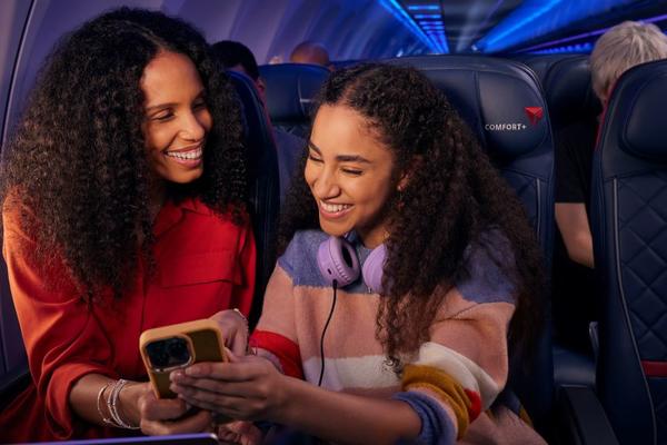Delta customers enjoy entertainment on their phone while taking advantage of Delta's fast, free Wi-Fi.