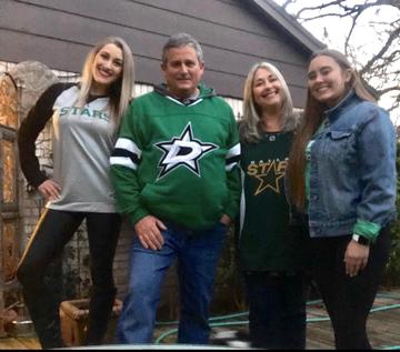 Greg Kaufmann with his family before a Dallas Stars game.