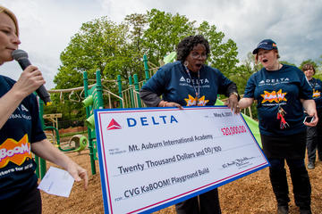 Delta donates $20,000 check to school