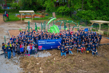 Group photo of employees with new playground
