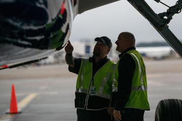 Delta employees inspect new A220 upon delivery to ATL